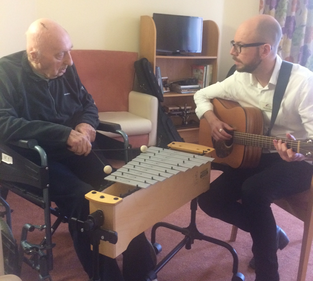Torrwood resident Paul Mosby and music therapist Michael Angus